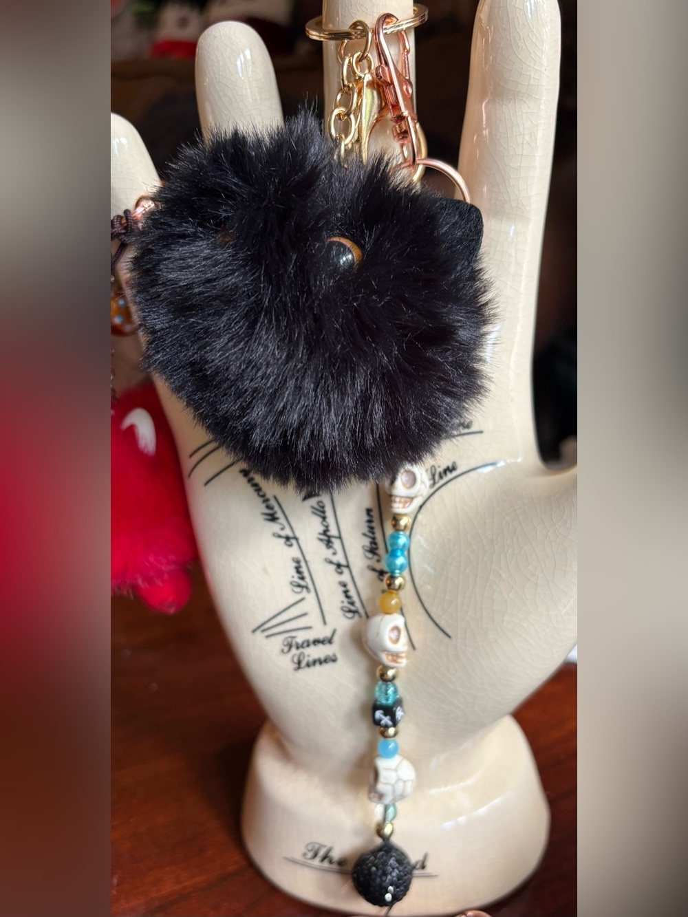 Black Faux Fur Pom Pom bag charm with skull beaded tassel keychain